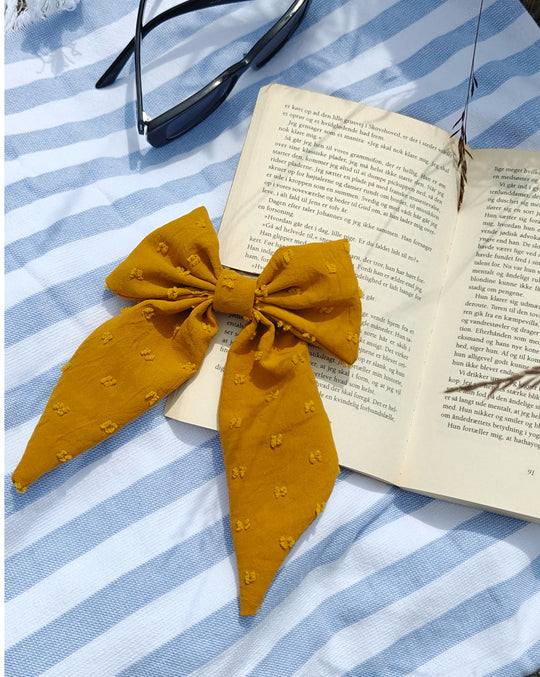 Yellow bow with hairclip